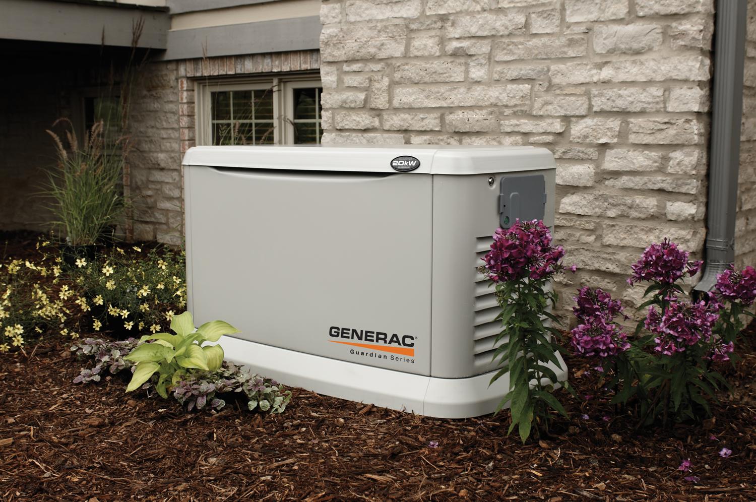 Generac generator outside of a Michigan home surrounded by flowers