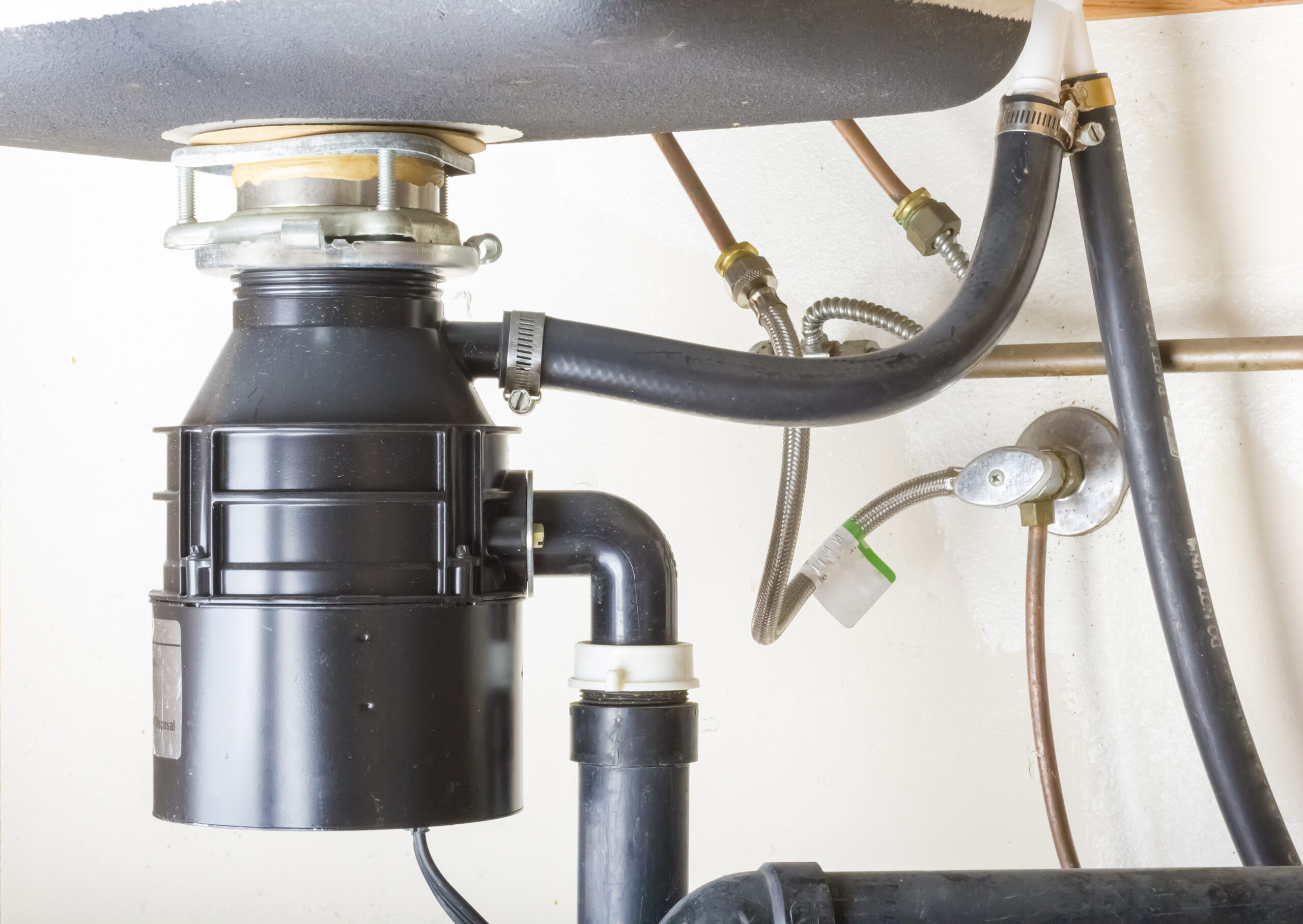 Garbage disposal installed under kitchen sink