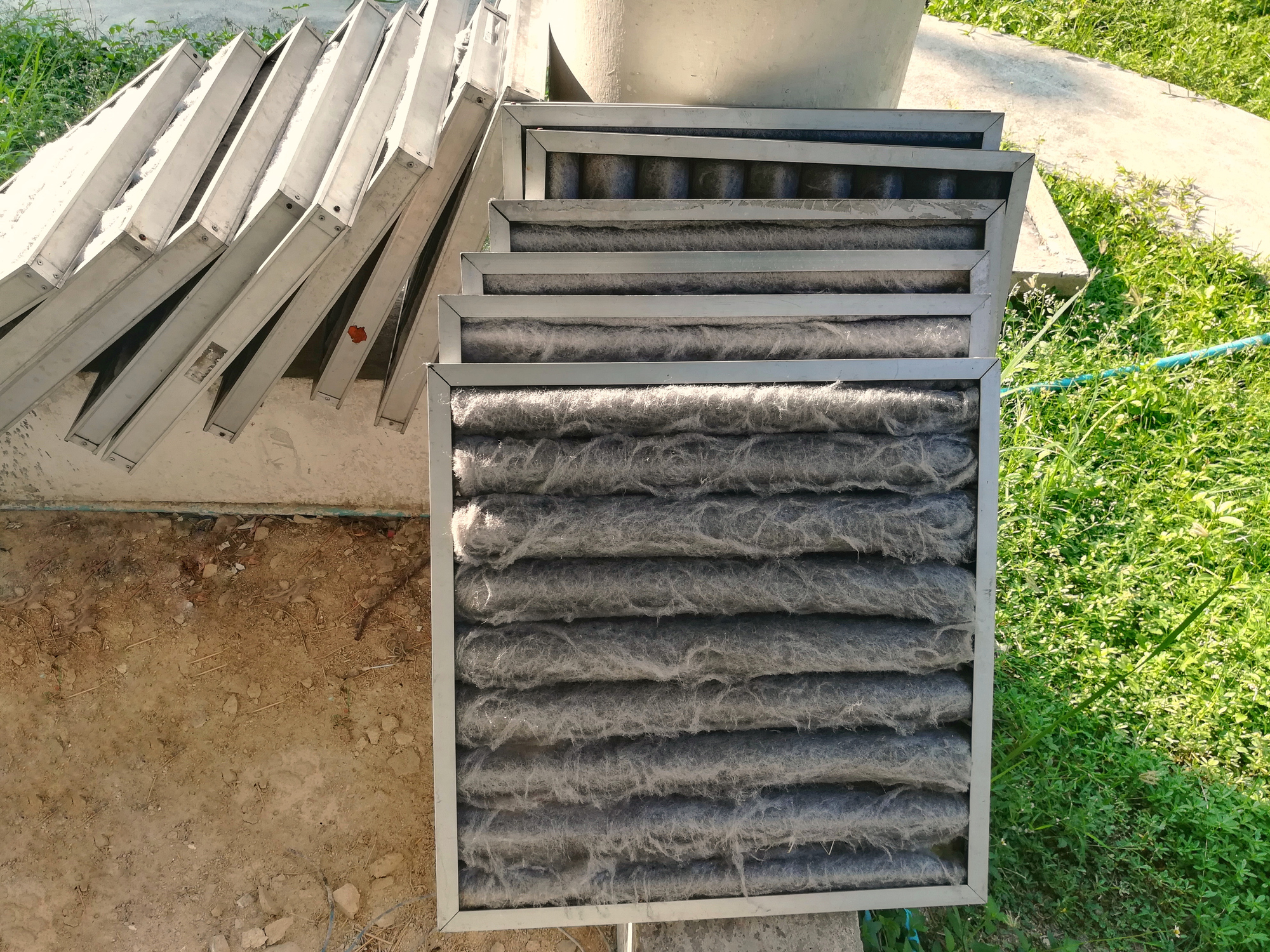 Stack of dirty air filters after performing AC maintenance