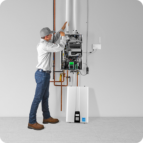 Plumber installing tankless water heater