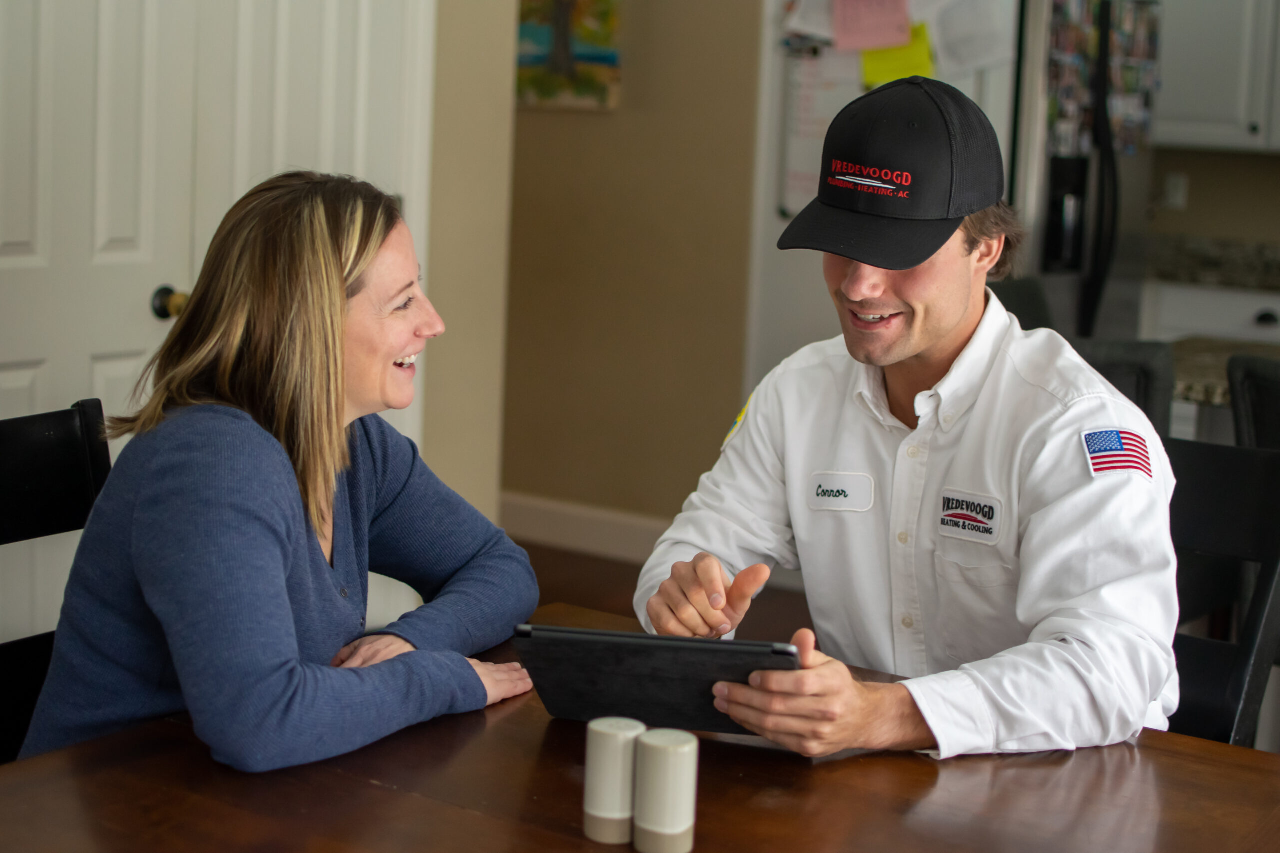 Vredevoogd technician speaking with a Brighton homeowner 