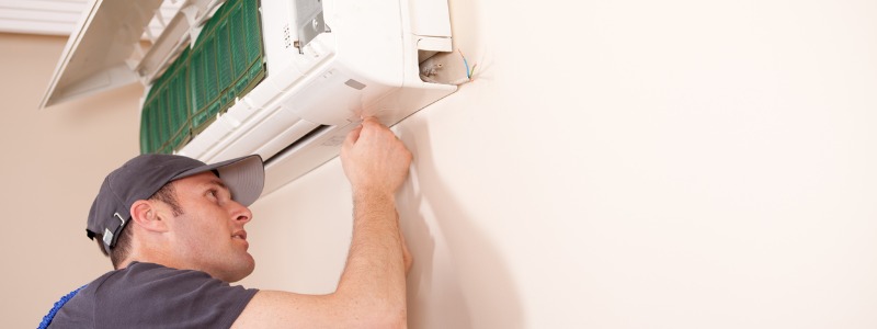 HVAC tech installing ductless HVAC